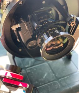 Setting up focus motor on Panavision 18mm lens for underwater work.