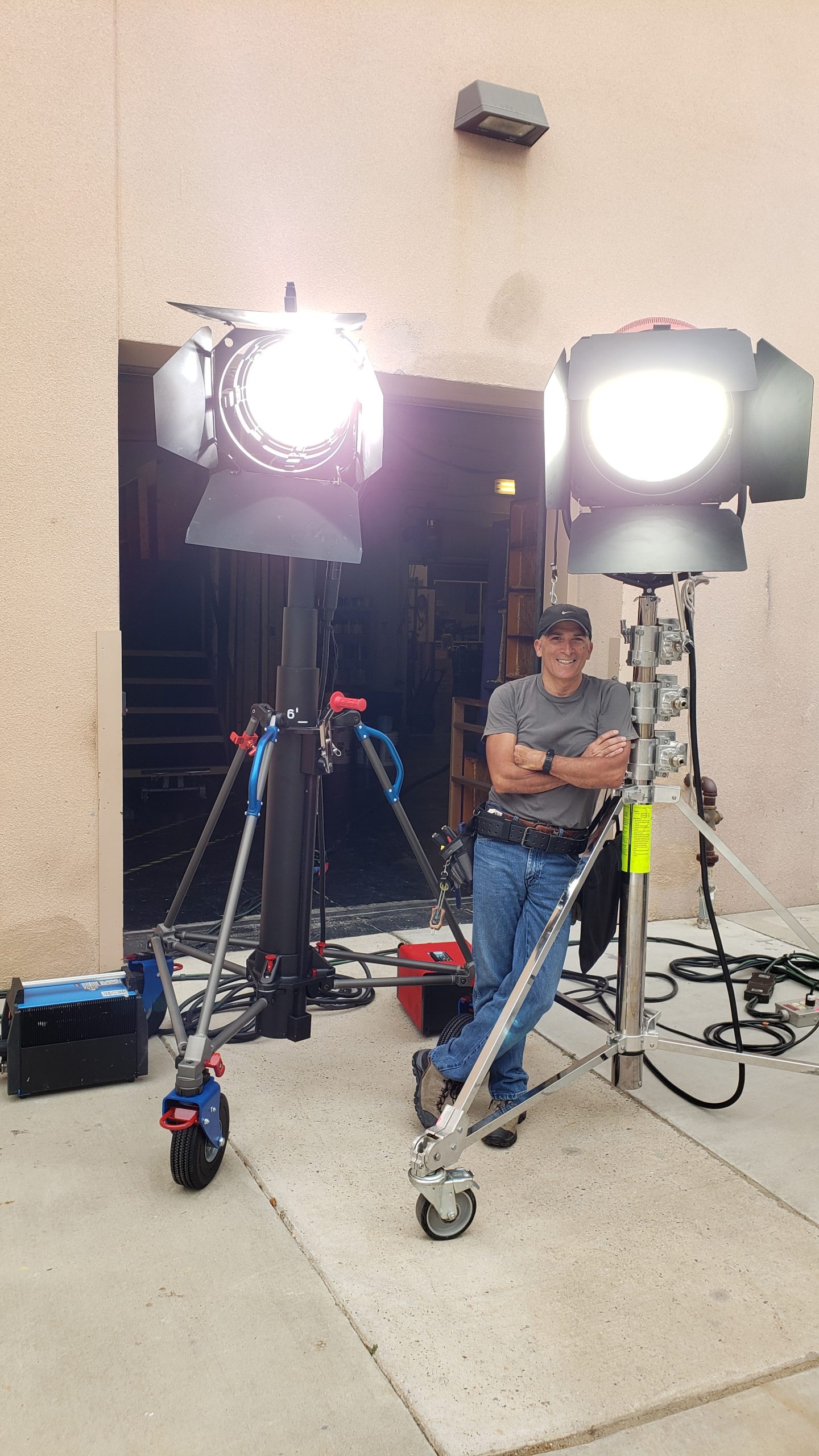 Carlos Vilkerman working as a Gaffer prepping for a night shoot